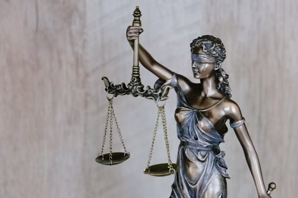 Gavel resting beside a calculator, symbolising tax law