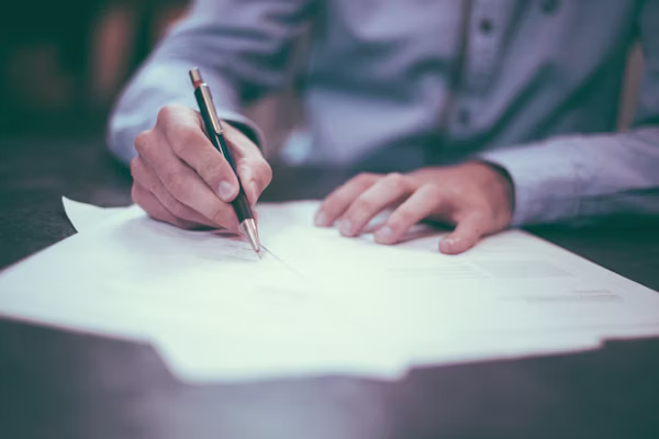 Magnifying glass over a printed contract document